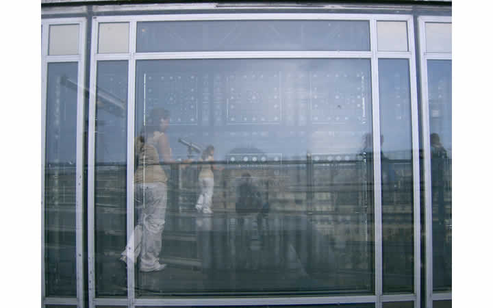 Color photo of a window and its reflection at the Museum of the Arab World