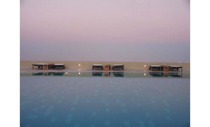 Color photo of a pool and the horizon