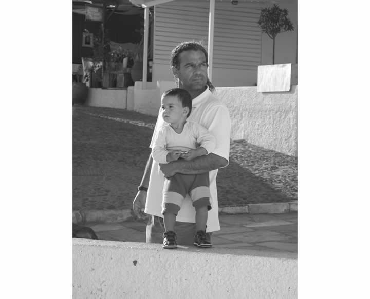 B&W photo of a very Greek man and his son