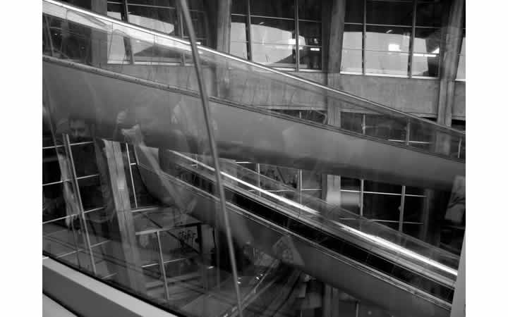 B&W photo of escalators in Paris airport